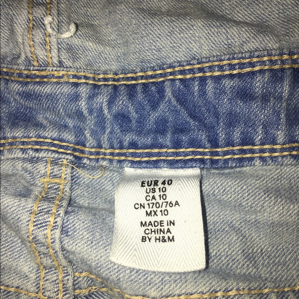 Jean jumpsuit distressed in the knees